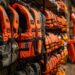 This photograph showcases a well-organized retail setting, with a focus on safety gear. Numerous orange life jackets, essential for aquatic activities, are displayed prominently on the shelves, ensuring easy access and visibility for customers. The strategic arrangement within the store emphasizes the importance of safety on the water, and provides a variety of options for adventurers and families preparing for their next nautical excursion.