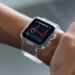 In the photo, a person is seen wearing a smartwatch with a clear protective case. The watch's screen shows a live heart rate monitor graph, indicating that the user is tracking their pulse in real time. It's a glimpse into the integration of technology in our daily lives, showcasing how wearable devices can help us keep an eye on our health metrics. This smart accessory serves not only as a piece of technology but also as a fashion statement and a fitness companion.
