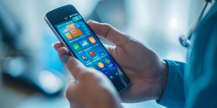 In this photo, we have a close-up view of an individual's hands holding a smartphone, actively engaging with a colorful screen filled with various mobile applications. The person is likely navigating through the device's interface, possibly checking emails, browsing the web, or interacting with social media platforms. The smartphone's display is brightly lit, showcasing the vibrant icons of apps that signify connectivity and the digital era we live in.